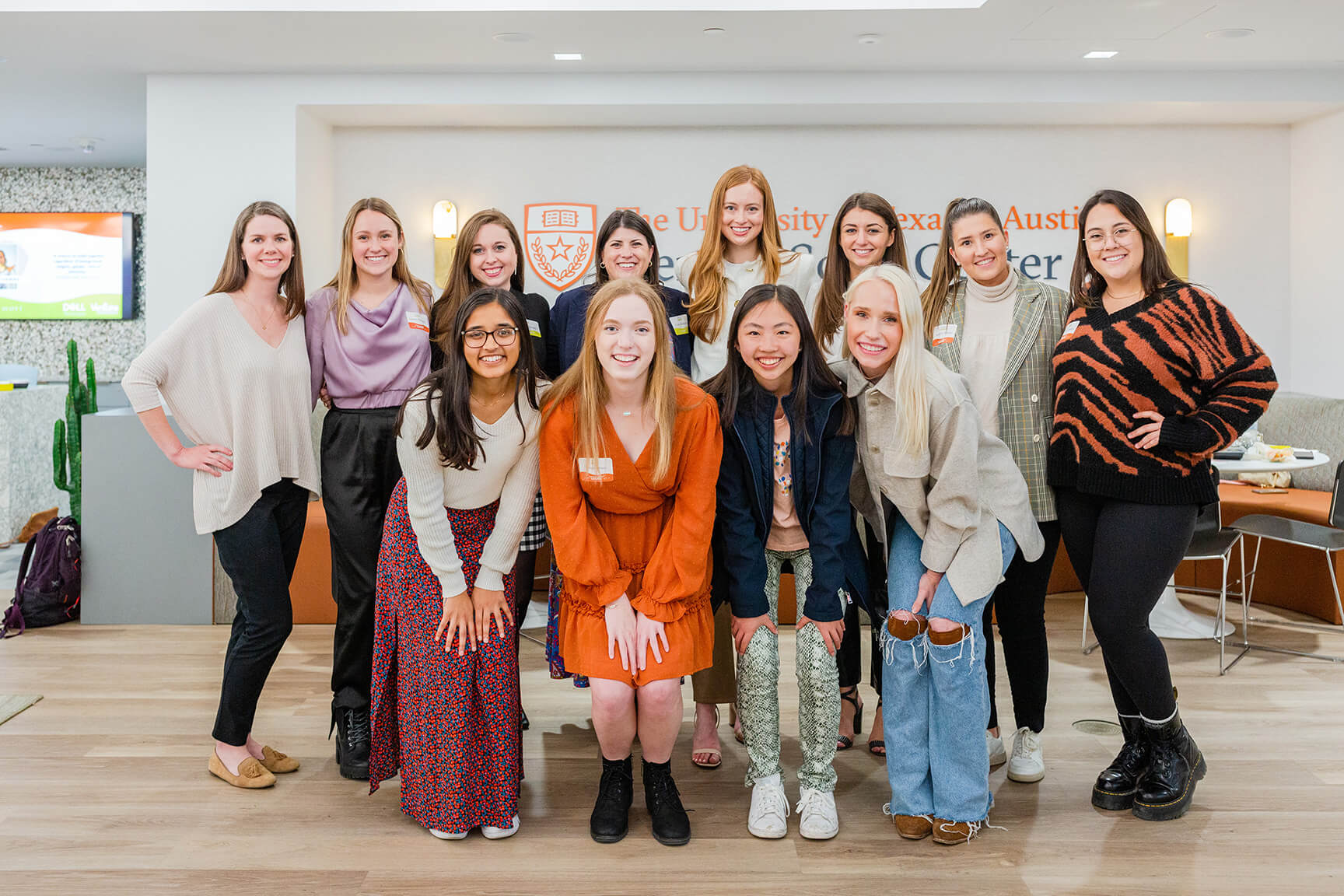 A group of young women posing for a photo inside the Kendra Scott Women's Entrepreneurial Leadership Institute