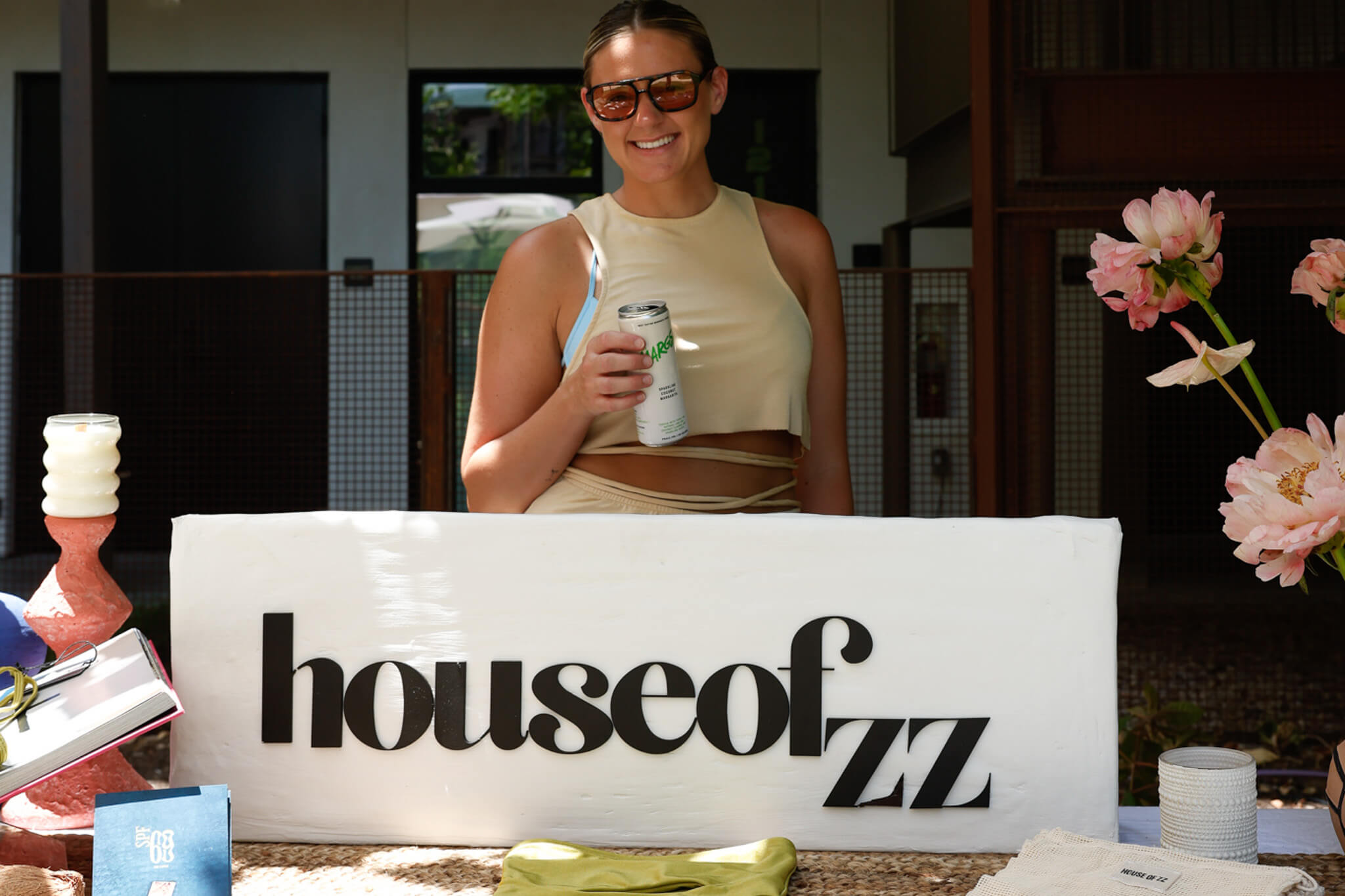 House of ZZ founder by a sign