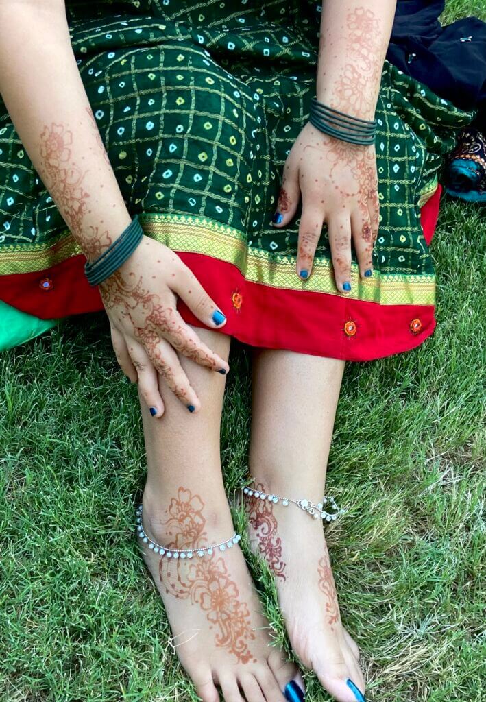 Hands and feet with henna art