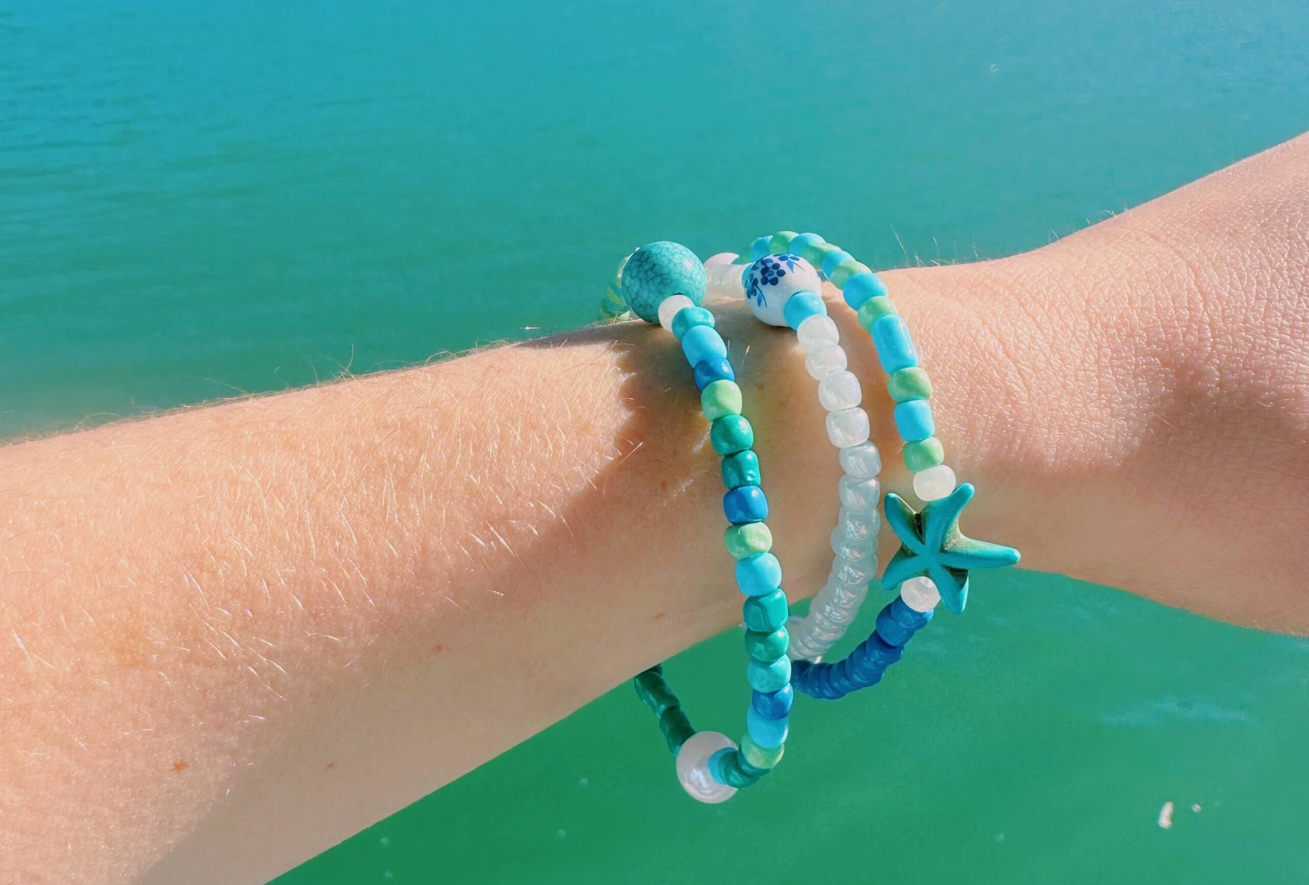 Turquoise bracelets on an outstretched arm